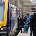 Passengers board train.