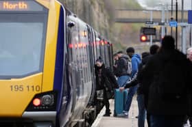 Passengers board train.