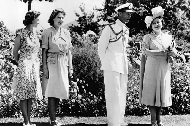 Princess Elizabeth poses with her father, King George VI, her mother Queen Elizabeth and her sister Princess Magaret in February 1947 in Cape Town during her first official state visit to South Africa. - The Queen and Princesses are British fashion ambassadors on this trip, and as such have benefited from special textile points granted by the Department of Trade. (Photo by Sport and General Press Agency Limited / AFP) (Photo by -/Sport and General Press Agency L/AFP via Getty Images)