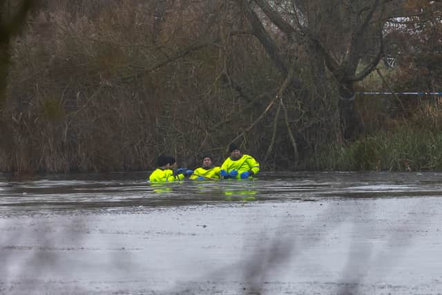 Rescue teams searching the freezing lake in Solihull for survivors.