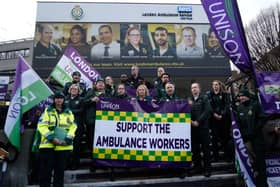 Christina McAnea, general secretary of UNISON, poses with ambulance workers at a picket line outside the Waterloo ambulance station in London on December 21, 2022. - Striking UK ambulance workers took to the picket lines, escalating a dispute with the government over its refusal to increase pay above inflation after recent walkouts by nurses. (Photo by Niklas HALLE’N / AFP) (Photo by NIKLAS HALLE’N/AFP via Getty Images)