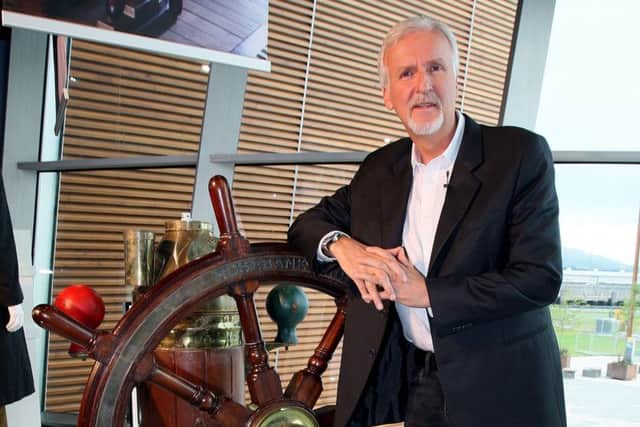 Titanic film director James Cameron with the ship's wheel from the movie, at the Titanic Belfast museum. A £14 million bid to buy a collection of more than 5,500 artefacts from the Titanic wreck site and bring them to Northern Ireland has been launched. Pic by Paul Faith/PA Wire