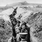 28th October 1914:  British soldiers lined up in a narrow trench during World War I.  (Photo by Hulton Archive/Getty Images)