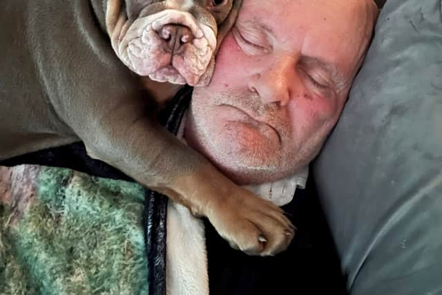 Ain’t nothing but a hound, Doc: David Lindsay with his British Bulldog puppy, Harley. 