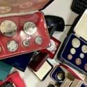 The secret collection, which includes a William III crown dating back to 1696, could fetch in excess of £17,500 at auction.