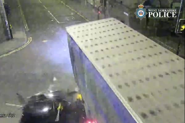 The car is seen smashing into the lorry.