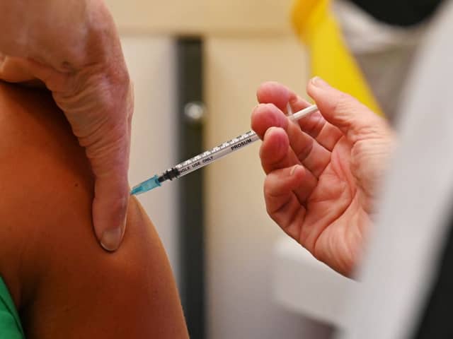 A member of the public receives a dose of the Pfizer BioNtech vaccine at a vaccination centre (Getty Images)