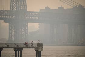 The New York city skyline and east river shrouded in smoke in Brooklyn as smoke from the hundreds of wildfires blazing in eastern Canada drifted south (Photo: Getty Images)