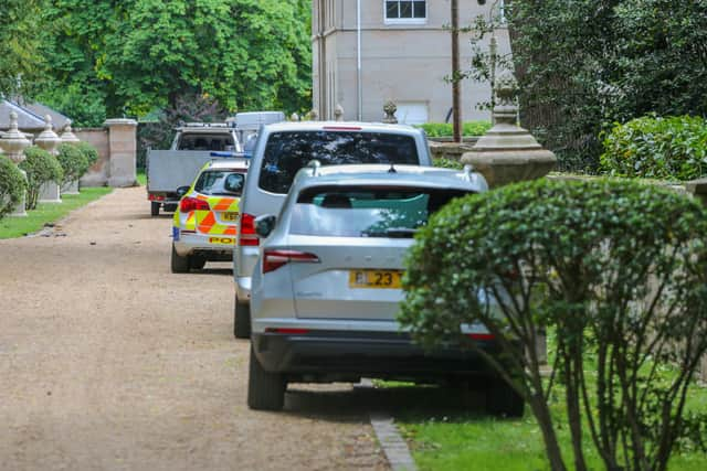 Police at Ombersley Court where the hot air balloon got tangled in trees after deflating and falling from the sky.