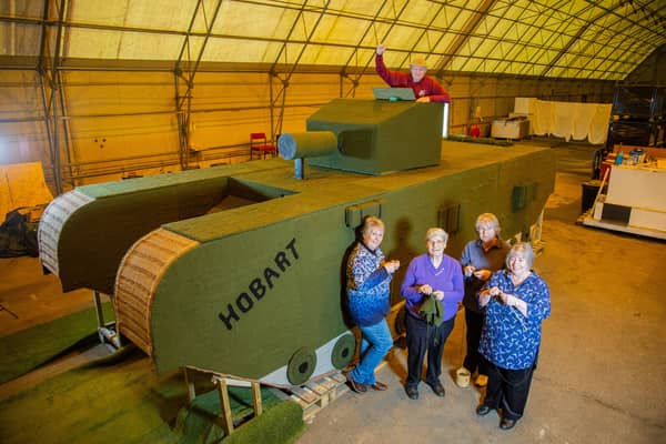 (L to R) Lynn Hart, Hazel Barker, Carol Dunkley, Sandra Searle and Stuart Martin beside the knitted tank.