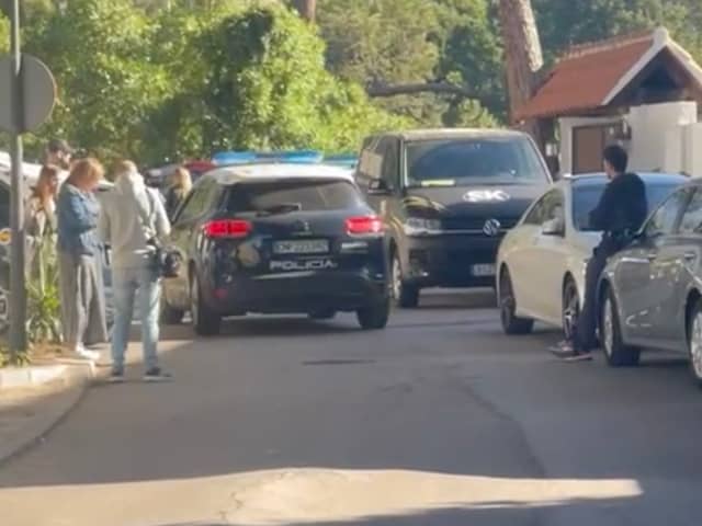A police car patrols the street outside the Marbella Airbnb on April 25. 