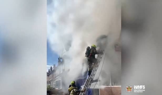 Firefighter rescues man from burning flat.