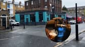 The Spit & Sawdust, one of the cheapest pints in London. Inset: Photo by DANIEL LEAL/AFP via Getty Images