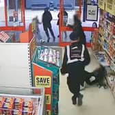 This is the shocking moment a prolific shoplifter barged over two elderly woman after stealing frozen lamb from Iceland.  