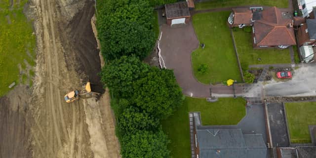Cracks appear in driveways after start of nearby building work.