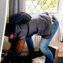 Kevin Wall (L) is pictured (R) by the heavily pregnant woman, in her home.  