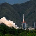 A rocket successfully lifts off from a space base in Xichang, in China's southwestern Sichuan province on June 22, 2024. (Photo by ADEK BERRY/AFP via Getty Images)
