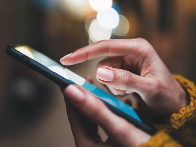 Woman scrolls on a mobile phone.  Photo: A_B_C - stock.adobe.com