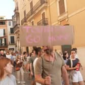 Anti-mass tourism protesters march through Palma’s streets.