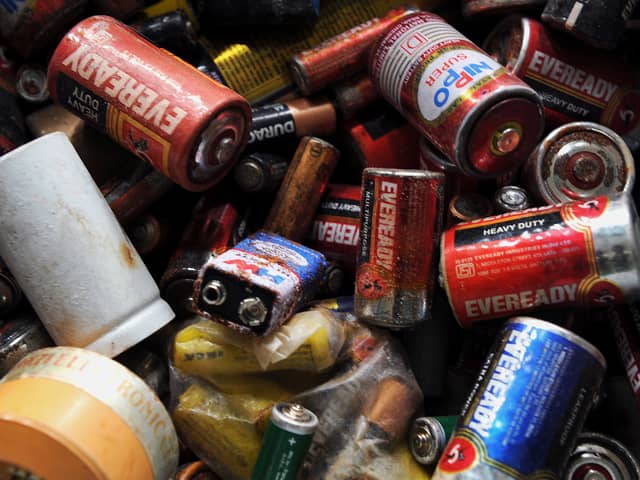 A pile of dead batteries. Photo: Manjunath Kiran/AFP via Getty Images