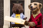 Compare the Market mascots Carl and Aleksandr appeared outside what looks remarkably like 10 Downing Street to mark the start of The Hundred.Photo released July 23 2024. 