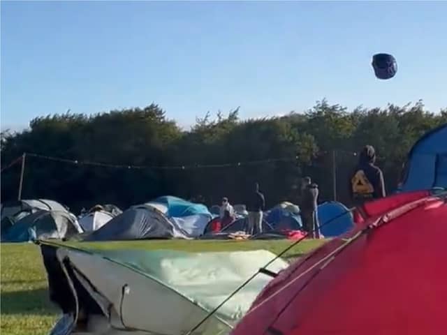 Tent hurtles across sky as Storm Lilian hits Leeds Festival.