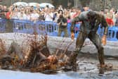 Hundreds of revellers descended on a pub garden to watch the 'world gravy wrestling championships.' 