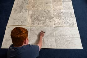 Jake Daniels-Shipsmith with his incredible city map which he has been working on for seven years. 