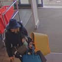 Footage of Tanya Liddle using a hat as disguise in one of her shoplifting ploys