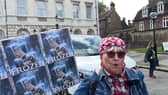 Protester speaks at winter fuel cuts rally.