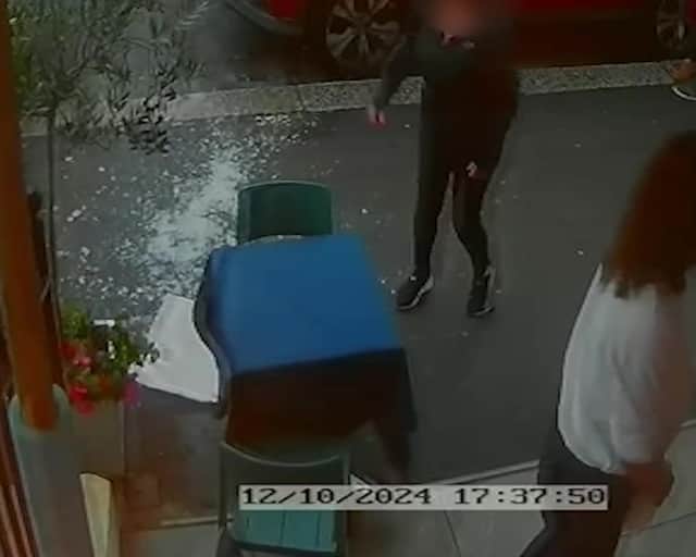 Video grab from this shocking footage shows an alleged attack on restaurant staff - in a dispute over paying a bill at La Bella Vista in Hastings, East Sussex.