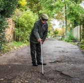 Furious resident Douglas Debnam on Whitebarns Lane in the village of Furneaux Phelham in Hertfordshire, is embroiled in Britain's longest running pothole row.