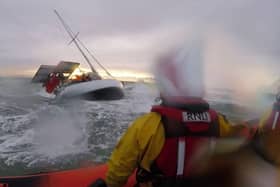Dramatic footage shows the terrifying moment huge waves crashed into a yacht- seconds before rescue. 