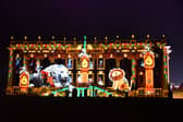 Chatsworth House is now ready and open for the public to enjoy its Christmas theme. Pictured is the front of the house with a light projection of a scene from the story Henry And The Lion's Christmas Feast.
