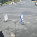 Man falls from car after clinging on after bag theft.