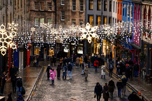 Members of the public are seen in Edinburgh as the city gears up for the festive period on December 05, 2023 in Edinburgh, Scotland. The capital's Christmas countdown commenced with the opening of the iconic Christmas Market at Princes Street on November 17, followed by the illumination of Edinburgh's Christmas Tree on the Mound on November 20