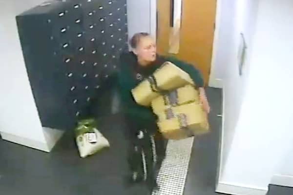 This is the moment a bold thief walks into a luxury apartment block and steals residents Amazon parcels.  