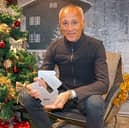 Andrew Ridgeley celebrates Wham! earning the 2024 Christmas Number 1 single for a second year in a row after the announcement on BBC Radio 1 moments ago.