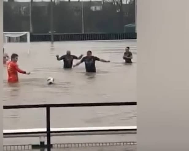 Lydney Town AFC players swim in flooded pitch