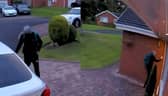 Burglar tries to knock on homeowner's front door.