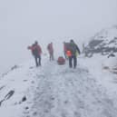 Injured man rescued from snow-covered mountain