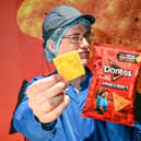 Chief Chip Technician Dan Lynes inspects the world's first square Doritos