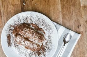A video of people eating tiramisu straight out of a compartment in their car has went viral. 