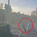 Woman comes within ‘half a second’ of being struck by train at level crossing.