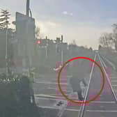 Woman comes within ‘half a second’ of being struck by train at level crossing.