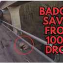 A person preparing to rescue a badger from a 100 metre drop