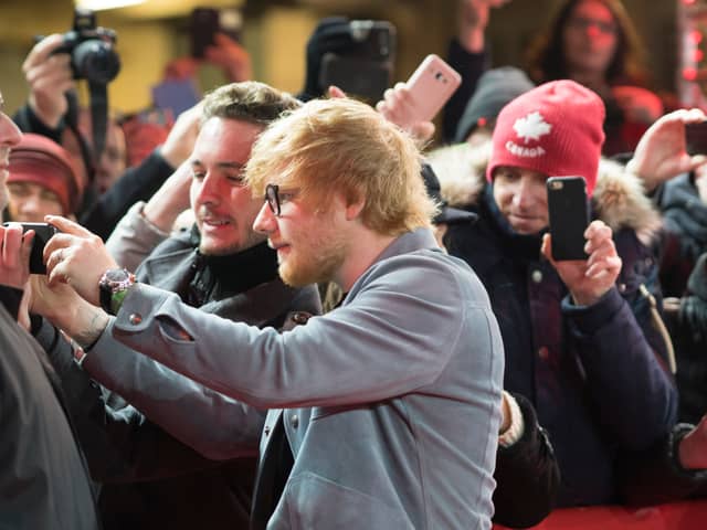 Getting everyone in the shot is Brits biggest frustration when it comes to taking group shots