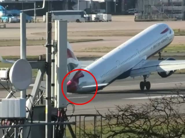 Tail of British Airways jet hits runway during aborted landing.
