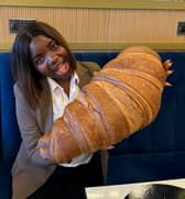 Emmanuella Okpoko with the massive croissant at P&D Gran Caffè in Liverpool.