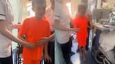 Jacob, 10, takes first steps after emergency brain surgery following road traffic accident.